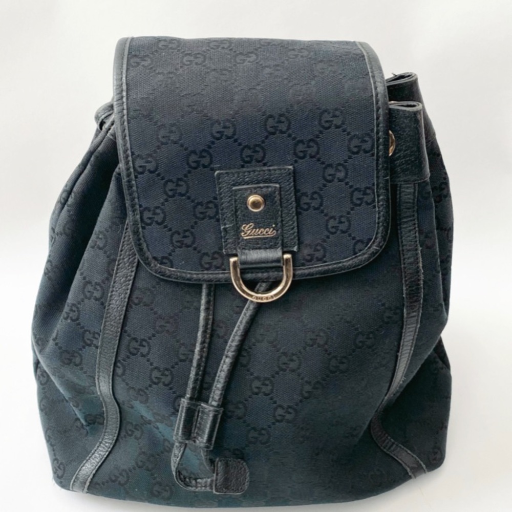 Gucci Black GG Canvas Drawstring Backpack with Gold Accent
